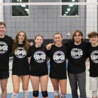 Students wearing championship shirts from a lower bracket volleyball tournament